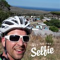 I love my tech, but love a ride around the Peninsula even more! Here I am on top of Red Hill with a characteristic SA background: a township that plays gospel music every time I pass on Sunday morning and the blue, bone-chillingly cold ocean in the back! Hope to see you on the road – but when in a car: Stay wider of the (bicycle) rider!