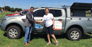 Ensly Dooms from Ford South Africa and Paula Barnard from World Vision SA at the official handover of the Ford Rangers in Soweto, Johannesburg.