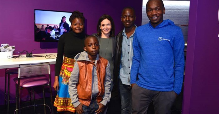 Sheryl Sandberg with young Malawian developers