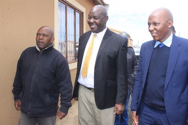 George Maseko (left) is one of the beneficiaries of the houses funded by South32. He gets officially handed keys to his new house by executive mayor of Steve Tshwete Local Municipality Mike Masina and Paul Masia who is South32 Coal South Africa vice president - Eastern Operations.