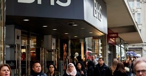 Pedestrians walk past the entrance to a BHS store on Oxford Street in central London on 25 April 2016.
