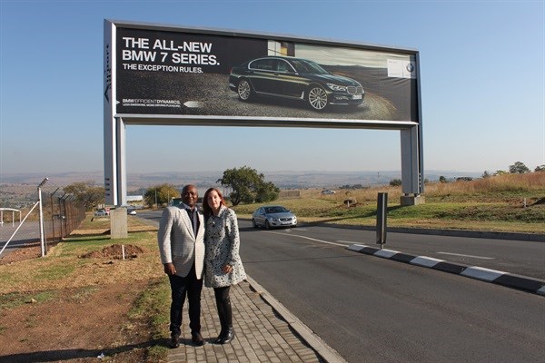 Mzukisi Deliwe of Airport Ads® stands with Claudia Vianello of Lanseria International Airport