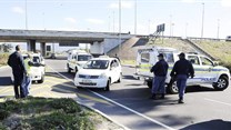Source:  - Police block metered taxi drivers from protesting against Uber cab drivers outside Cape Town airport. Picture: Michael Walker/INLSA