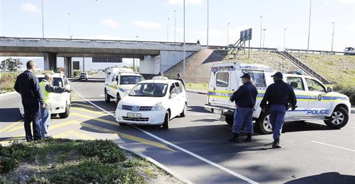 Source:  - Police block metered taxi drivers from protesting against Uber cab drivers outside Cape Town airport. Picture: Michael Walker/INLSA
