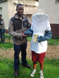Tshepo Lebese congratulates Witness Chileza on her homemade beesuit, complete with smoker and hive tool.