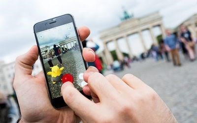 A picture shows a man using the 'Pokemon Go' augmented reality mobile phone app in front of the Brandenburg Gate in Berlin, Germany on Wednesday.<p>Picture: