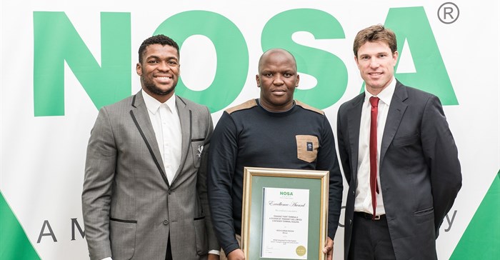 Recipient of the NOSA award in the middle, Vuyani Mtati, SHEQ Manager PE, received six awards.
