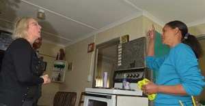 Councillor Van Minnen inspects the ceiling of Mrs Jennifer Jonas in Vrygrond.