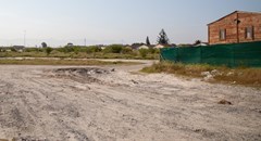 Eight years after a commitment to build houses there, the Thembokwezi site in Khayelitsha is still empty. Photo: Ashraf Hendricks