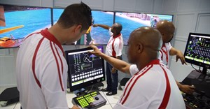 Simulation facilitators (left to right) Ebrahim Bayat, Thamsanqa Khanyile, Musa Ngubane and Vika Njoko demonstrate the equipment’s features at the Transnet Maritime School of Excellence in Durban. - Stephen Railton