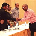 Paul Muhato, Managing Director of Engen in Tanzania shakes hands with the Prime Minister of Tanzania.