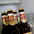 Bottles of SABMiller's flagship brew, Castle Lager, at a bar in Cape Town. Almost 120 years after first listing, its name will disappear from the JSE board this week.
Picture: