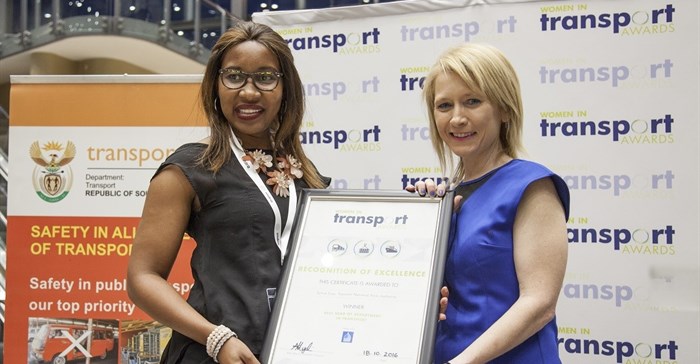 Sylvia Siyo, Acting Ship Repair Manager in the Port of Durban (left), receiving the Best Head of Department in Transport award from Catherine Larkin, Executive Director of the Chartered Institute of Logistics and Transport.
