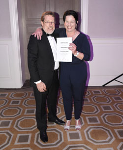 Andrea Anderson, GM of City Lodge Hotel Lynnwood, receives her Hotelier of the Year Award from chief executive Clifford Ross.
