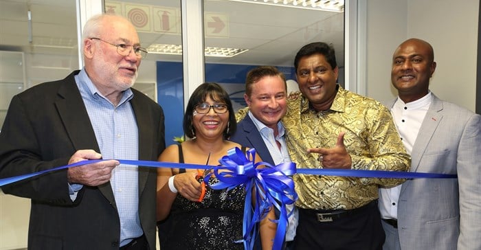 Ribbon-cutting for WorldVentures new office opening. From Left to right: John Keogh (Director of Compliance South Africa), Cassandra Devraj and Soojay Devraj ( International Marketing Directors), Kyle Lowe (Senior Vice President of Global Sales and International Expansion) and Kemble Morgan (General Manager Africa)