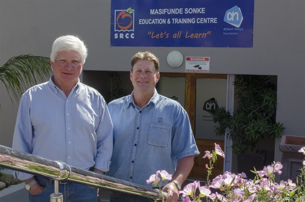 Ken Nieuwenhuizen (left), SRCC director of transformation and development, and Frikkie Olivier, SRCC operations manager who oversees the various empowerment projects, stand in front of the company’s empowerment training facility, the Masifunde Sonke Education and Training Centre.