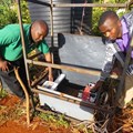 - Daniel Maitethia (left) shows one of his students how to use the water irrigation system in Meru, Kenya, June 16, 2016. Photo: Caroline Wambui