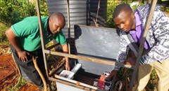 - Daniel Maitethia (left) shows one of his students how to use the water irrigation system in Meru, Kenya, June 16, 2016. Photo: Caroline Wambui