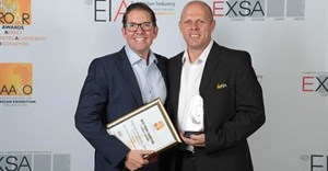 Nick Sarnadas, event director of Food and Hospitality Africa, and Gary Corin, managing director of Specialised Montgomery Exhibitions, accept the award.
