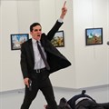 Mevlut Mert Altintas shouts after shooting Andrei Karlov, the Russian ambassador to Turkey, at an art gallery in Ankara, Turkey on 19 December 2016.
Picture: Burhan Ozbilici,