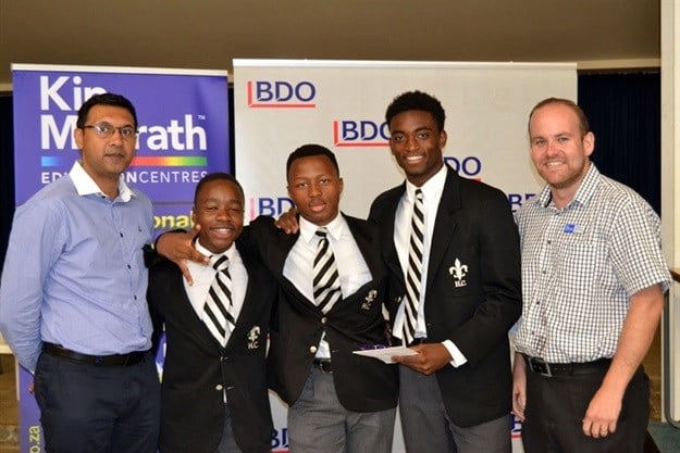 The proud second round winners of the BDO Schools Quiz, this team of Grade 10/11 learners from Hilton College are awarded their prize by Sumesh Somaroo of BDO, Shingai Mushonga, Menzi Cele, Khalid Thomas with James Hollins of Kip McGrath.