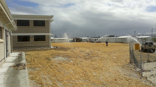 Irrigation of newly seeded sports filed at school in Delft.
