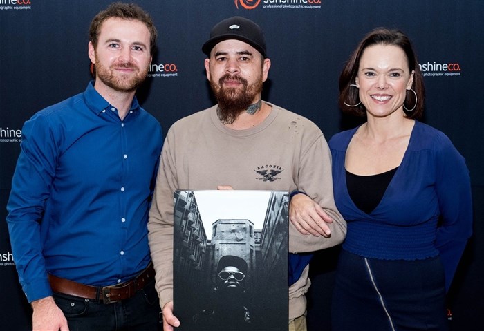 Sunshine co's digital sales manager, Willem Foster, Zeno Petersen (winner) and Karlien Murray from AtPhoto ©