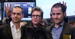 Twitter co-founder Biz Stone, at center in 2013 photo at the New York Stock Exchange debut of the social network, is flanked by co-founders Jack Dorsey, at left, and Ev Williams. Stone is returning to work at Twitter after a six-year hiatus |