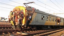 Commuters climbing on a Khayelitsha-bound train. Photo by Mandla Mnyakama
