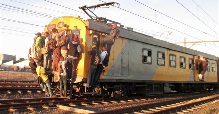 Commuters climbing on a Khayelitsha-bound train. Photo by Mandla Mnyakama
