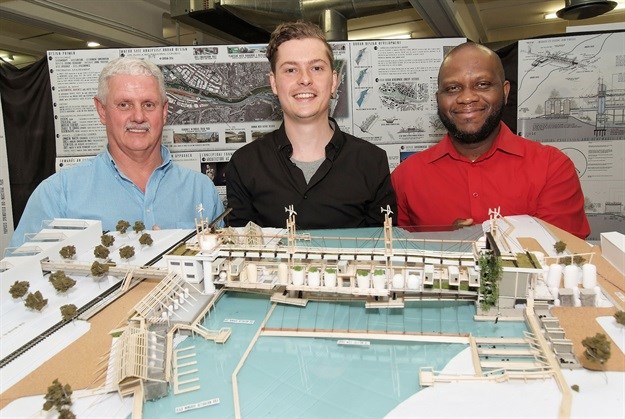 Jean-Pierre Desuaux De Marginy holding a model of his winning design with Allin Dangers (left) director of sales, KZN & Border and Lawrence Ogunsanya (right), head of the Department of Architecture at UKZN.