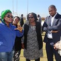 Tourism Deputy Minister Elizabeth Thebethe, Deputy Minister of the Presidency Buti Manamela and North West Tourism MEC Desbo Mohono engaging with one of the exhibitors at the Youth in Tourism Imbizo