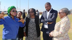 Tourism Deputy Minister Elizabeth Thebethe, Deputy Minister of the Presidency Buti Manamela and North West Tourism MEC Desbo Mohono engaging with one of the exhibitors at the Youth in Tourism Imbizo