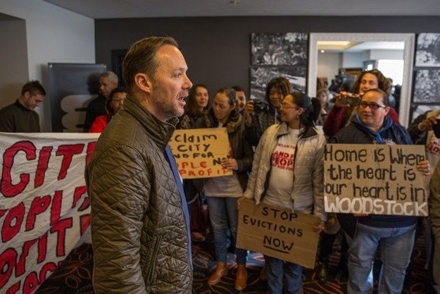Mayoral committee member for urban development Brett Herron speaks to supporters of Reclaim the City during the fourth annual Affordable Housing Africa Conference in Cape Town. Photo: Ashraf Hendricks