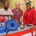Co-owners of Majozi Brothers Construction Sihle Ndlela (left) and Simphiwe Majozi (right) celebrate the launch of Majozi Bros Tool Hire & Sales with Hire-It Natal's Richard Fraser.