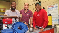 Co-owners of Majozi Brothers Construction Sihle Ndlela (left) and Simphiwe Majozi (right) celebrate the launch of Majozi Bros Tool Hire & Sales with Hire-It Natal's Richard Fraser.