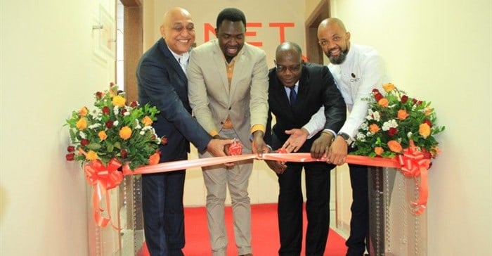 QNET Board Adviser, David Sharma; Deputy Minister for Health, Community Development, Children and Elderly, Hamisi Kigwangalla; Permanent Secretary for Trade, Industry and Investment Adelhelm Meru and QNet Country Representative for Tanzania Benjamin Mariki cut the ribbon during the opening of QNet agent office in Tanzania.
