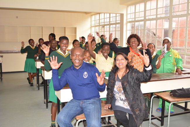 Chairwoman of the Educor Education Foundation, Mrs F. Chetty, with the principal of Inanda Newton Secondary, Mr T.C. Chauca, together with pupils at the science lab.