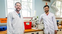 PhD chemistry students Anton Hamann (left) and Jonathan Hay with the ‘Closed-Cold-Water-Recycling-System’ they developed for their laboratory in the De Beers Building at Stellenbosch University. Photo: Stefan Els