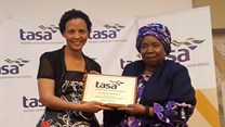 TASA President, Mary Phadi handing Dr Nkosazana Dlamini-Zuma a token of appreciation after her keynote speech.