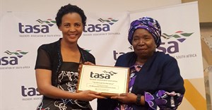 TASA President, Mary Phadi handing Dr Nkosazana Dlamini-Zuma a token of appreciation after her keynote speech.