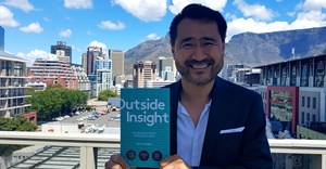 Meltwater CEO Jorn Lyseggen with his book, Outside Insight.