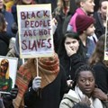 Protestors attend a demonstration against slavery in Libya, at Sergels torg in Stockholm, Sweden, on November 25, 2017 |