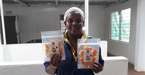 Sweet n Dried founder Mercy Mwende at the processing factory with dried mangoes. (Image Supplied)