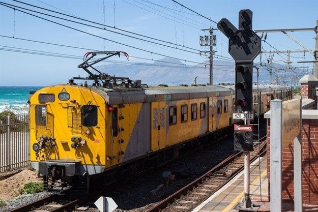 A Metrorail train passing Muizenberg train station in Cape Town. Photo: Ashraf Hendricks/GroundUp