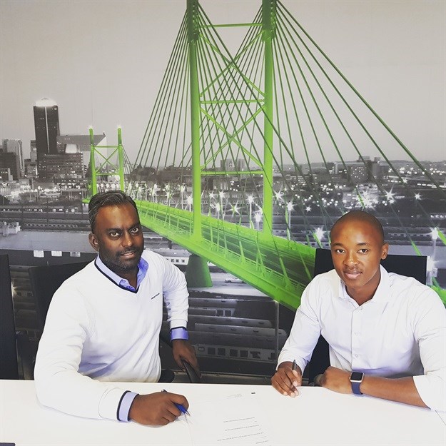 Andrew Maren from PSP and Thapelo Masoko from Edge Action, signing the deal.