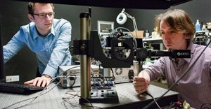 Stanford researchers David Lindell (left) and Matt O’Toole work on a laser-based system that can detect hidden objects around corners (Credit: L.A. Cicero)