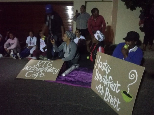 Tenants facing eviction gathered outside Brett Herron’s home from 5am to demand answers to questions about the City of Cape Town’s plans for emergency housing. Photo: Barbara Maregele