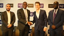 Tigo managing director, Simon Karikari, (second left), and the general manager of Uber East Africa, Loic Amado, shake hands after announcing the partnership between Tigo and Uber Tanzania in Dar es Salaam. Others are: Uber country manager, Alfred Msemo and Tigo’s head of mobile financial services, Hussein Sayed. Source: Tigo.