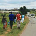 People stroll along Moshoeshoe Street in Emfuleni. Darya Maslova